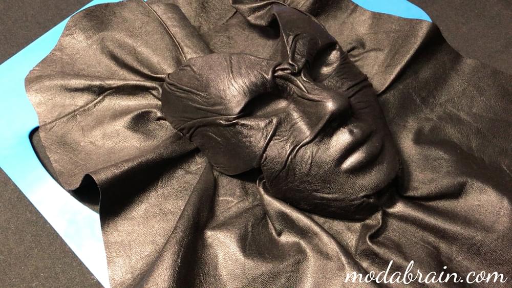 Decorating a handbag with a leather mask