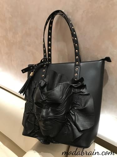 Decorating a handbag with a leather mask